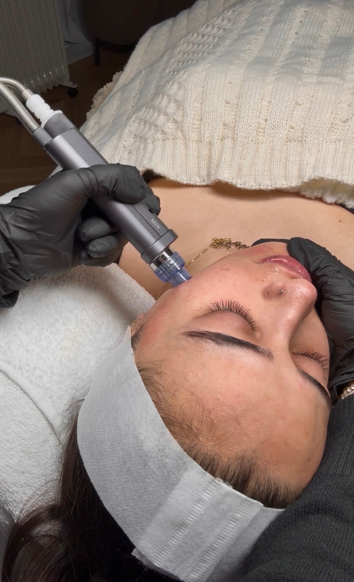 Client receiving a HydraFacial treatment at Alura Skin Studio