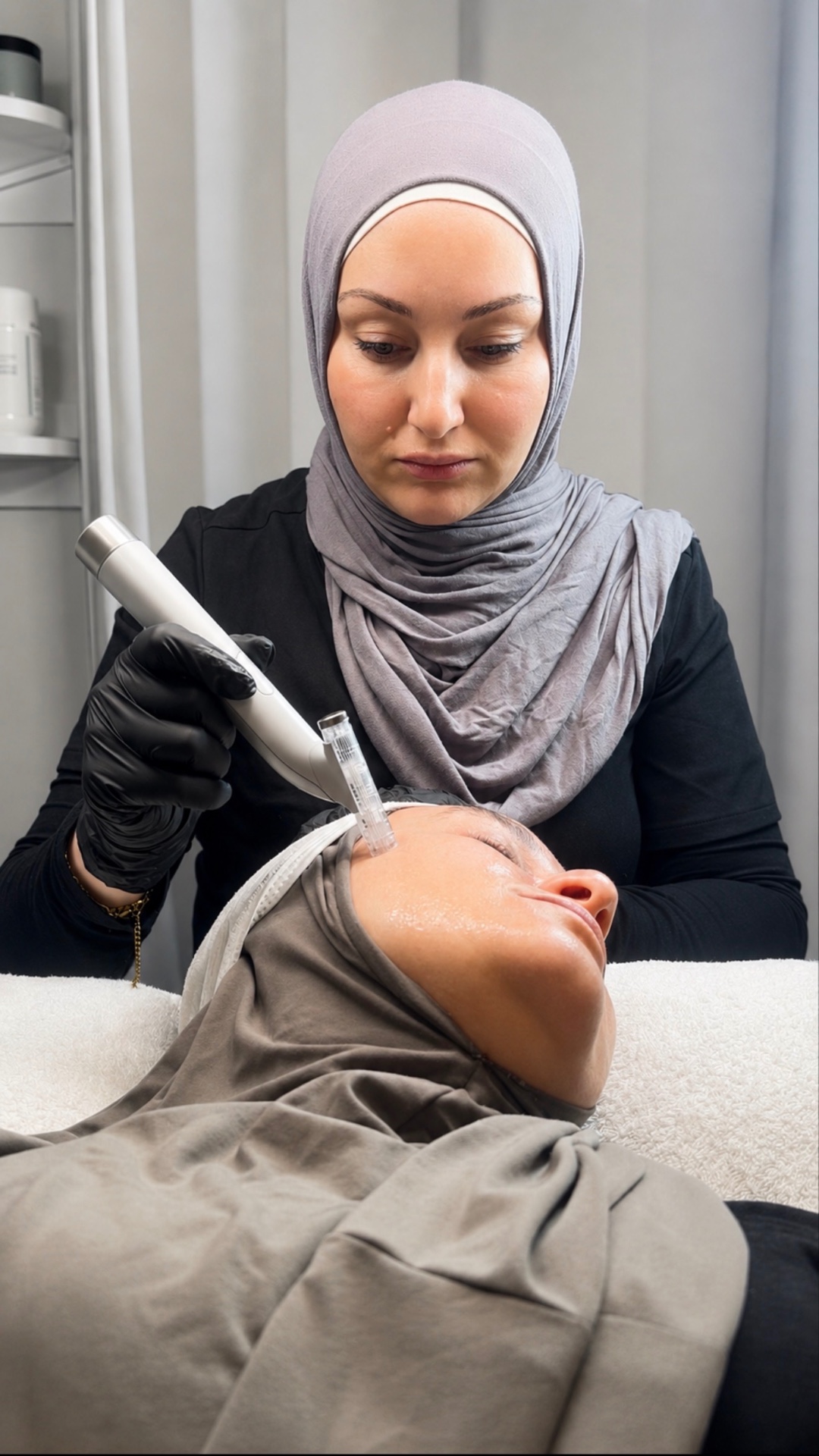 Therapist performing a microneedling treatment